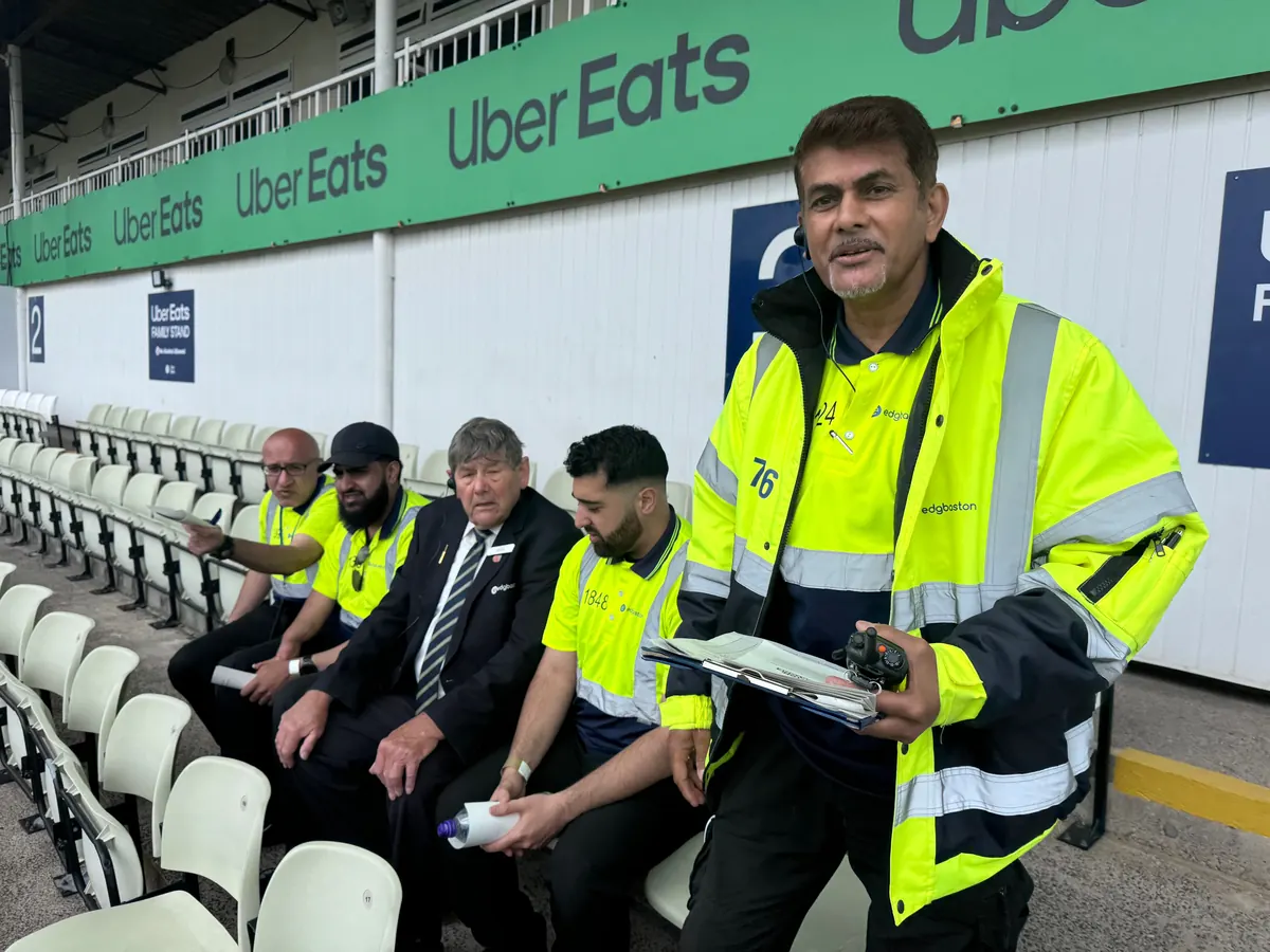 Steward briefing under the stand before a match